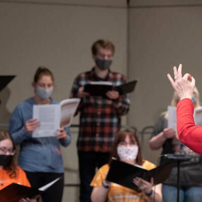 Professor of Music Susan A. Medley, DMA, conducts the W&amp;J choir during a rehearsal December 6, 2021 in the Olin Theatre on the campus of Washington &amp; Jefferson College in Washington, Pa.