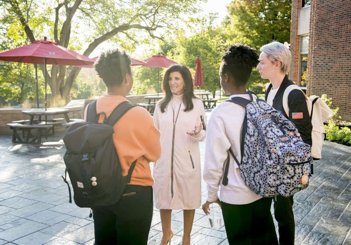 Students talk with faculty member Associate Professor of Economics &amp; Business Lori J. Galley, Ph.D., on the Rossin Campus Center Patio as seen October 21, 2019 during the Creosote Affects photo shoot at Washington &amp; Jefferson College.