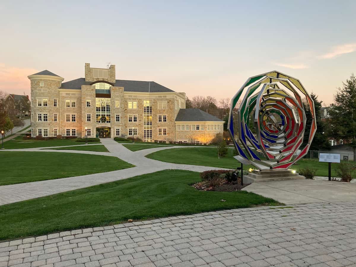 The 1970 statue and the Howard J. Burnett Center are seen November 18, 2020 from the sidewalk near the President’s House on the campus of Washington &amp; Jefferson College.